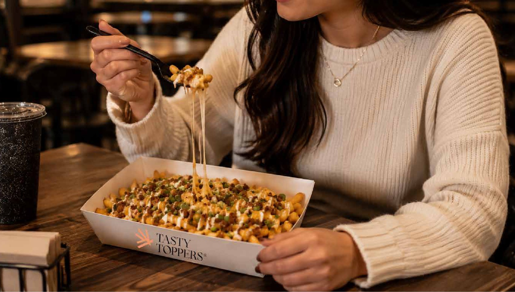 Loaded fries in a Tasty Toppers tray
